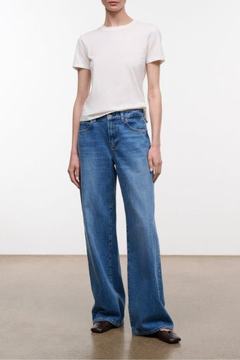Relaxed vintage-wash blue jeans with wide straight legs