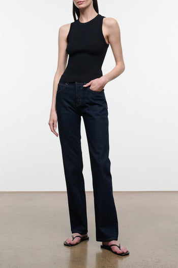 Indigo straight-leg jeans on model, dark wash denim with straight fit