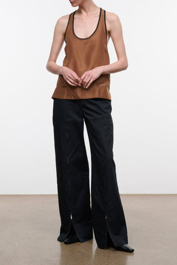 Black wide-leg trousers with relaxed fit and straight fall, full-length