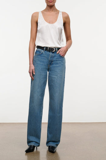 High-rise blue denim jeans with wide leg, belt loops, front button-and-zip closure
