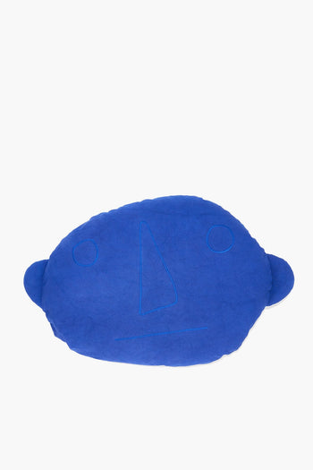 Blue plush floor pillow with stitched 4 design and small circle accents