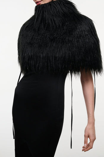 Black fringed faux-fur shrug with draped shoulders and long tie tassels