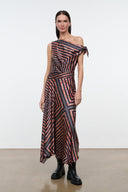 One-shoulder silk dress, black with rust and cream geometric pattern, draped asym hem