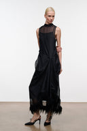 Black sleeveless dress front view with mesh overlay and knotted drape, feather hem
