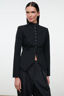 Black tailored jacket with high neck, button front, and asymmetrical peplum hem
