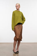 Relaxed cashmere crewneck sweater in green with ribbed neckline, cuffs, and hem.
