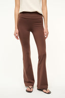 Dark brown flared-leg pants with straight waistband and full-length silhouette