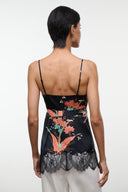 Noir silk camisole top with floral print and lace back hem, adjustable spaghetti straps