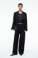Black high-rise wide-leg trousers with concealed fly and side pockets