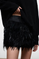 Black feather-fringe mini skirt with layered hem and wide waistband