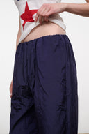 FLO pants in dark navy with gathered elastic waistband, side detail view