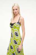Women’s chartreuse slip dress with black cartoon print, spaghetti straps, sleeveless