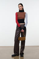 Cigar suede hobo bag carried at side with gold ring hardware and zip top