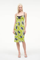 Women’s chartreuse slip dress with black cartoon print, spaghetti straps, straight fit