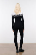 Black snowboard onesie with white fair isle yoke and zip-front, long sleeves, back view