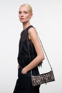 Porcupine quill clutch bag with slim shoulder strap, black fringe trim