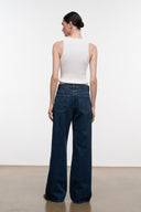 Relaxed dark-wash wide-leg jeans, rear view with patch pockets and belt loops