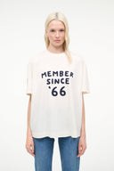 Cream crew-neck tee featuring centered navy 'MEMBER SINCE '66' print