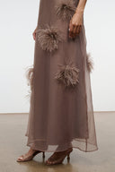Taupe maxi dress with feather flower appliques along the hem