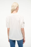 Cream crew-neck tee, back view, with small navy sleeve logo
