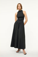Black sleeveless maxi dress with high neck, fitted waist, and full gathered skirt