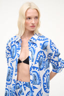 Women’s blue-and-white patterned button-front top with quarter sleeves, open front