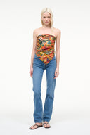 Silk scarf top in colorful travel print, strapless style worn with blue jeans