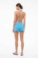 Women’s turquoise swim shorts with drawstring waist, back view