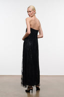 Black strapless column maxi dress with sparkling sequins and sheer hem