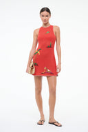 Red knit coverup dress with embroidered tropical motifs; side view with slim sleeveless straps