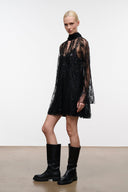 Black sequin mini dress with sheer long sleeves and ruffled high neckline