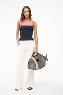 Black smocked peplum cami top with elastic neckline and thin straps