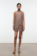 Taupe mini dress with high neckline and feathered trim at hem and cuffs