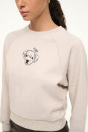 Stone crewneck sweatshirt detail: dog face graphic at upper chest