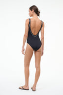 Black one-piece swimsuit back view with open U-back and silver eyelet strap trim