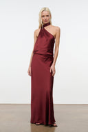 Wine satin halter maxi dress with asymmetric halter neckline and fitted waist.