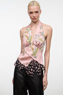 Pink silk halter top with multi-color print and ruffled bottom hem