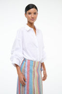 White long-sleeve collared button-up shirt, open neckline