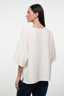 Ivory boxy short-sleeve tee, loose drape, back view
