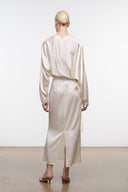 Ivory silk midi dress, back view with long sleeves, gathered cuffs, and tie waist