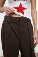Dark brown tailored pants with pleated front, belt loops, buttoned waistband