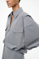 Grey shirt dress detail: flap chest pocket, zip front, high point collar