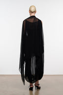 Black layered dress with sheer back cape overlay and draped tulle hem