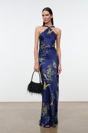 Dark blue silk halter maxi dress with gold tapestry print and tied neckline