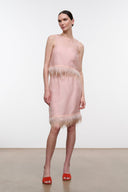 Light pink satin skirt with feather fringe hem, front view