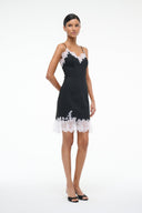 Black mini dress with white lace hem, slim fit, thin spaghetti straps
