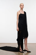Black sleeveless dress with one-shoulder strap and sheer overlay skirt