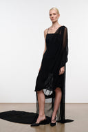 Black asymmetrical sleeveless dress with sheer side drape and layered hem