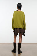 Dark brown skirt back view with uneven hem and frayed trim