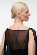 Black dress with open back and sheer mesh panel across upper back